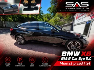 Samochód BMW X6 zaparkowany przed warsztatem po montażu systemu kamer.
